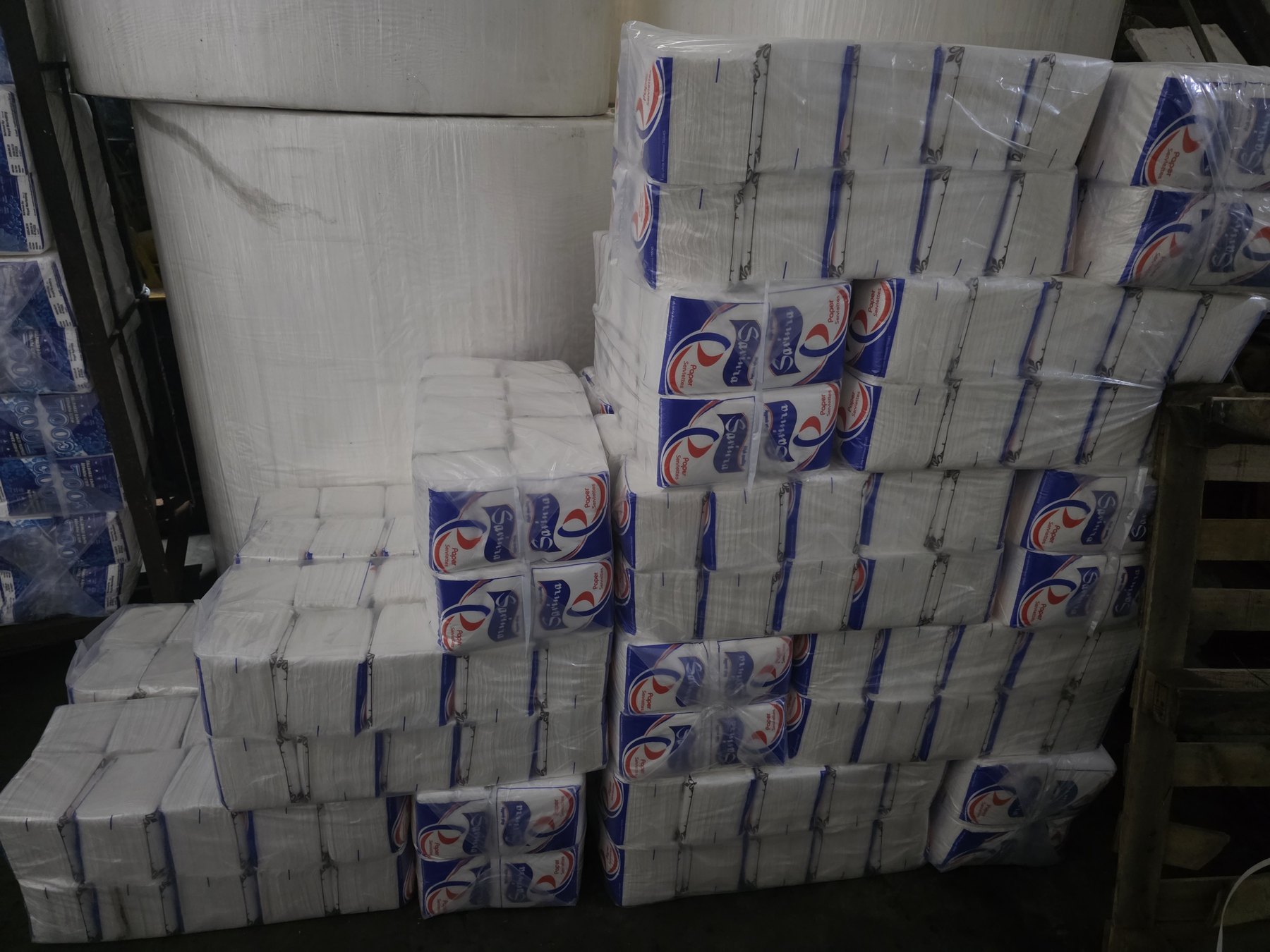 Wrapped paper rolls stacked in inventory